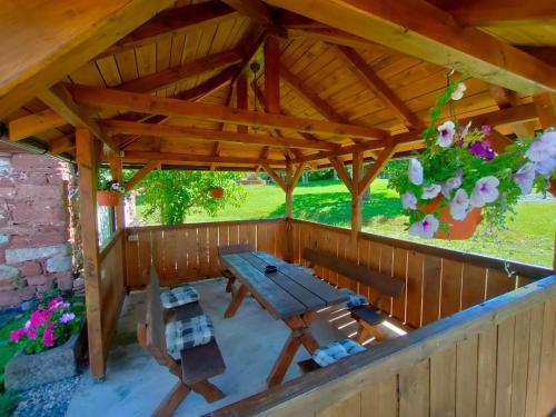 an overhead view of a wooden pavilion with a picnic table at Apartmány Slavíkov - Superior Apartmán in Horní Radechová