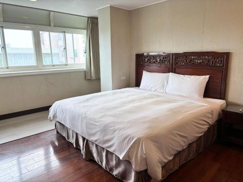 Postel nebo postele na pokoji v ubytování 花蓮凱悅旅店 Kaiyue Inn