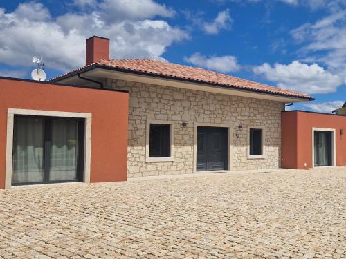 a house with a brick driveway in front of it at Casa Julia in Vila Nova de Cerveira
