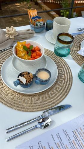 a table with a plate of food and a bowl of food at Terrazul Barichara in Barichara
