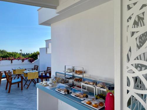 a counter with some food on a balcony at Casa Dolce Casa Ruvo Breakfast & bed in Ruvo di Puglia