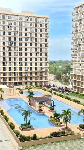an aerial view of a large building with a pool at DDs holistay in Lapu Lapu City