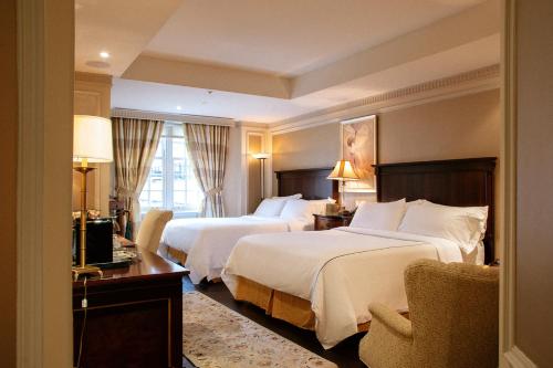 Postel nebo postele na pokoji v ubytování Windsor Arms Hotel