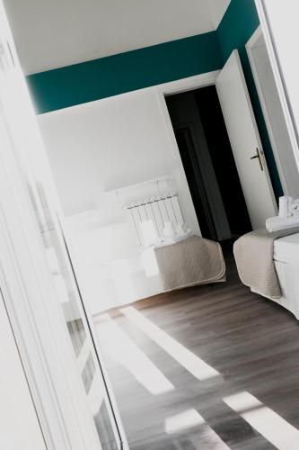a small room with a bed and a chair at Fatata Suites in Lecce