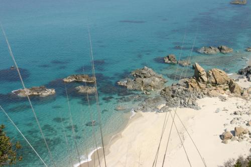 an aerial view of a beach with rocks and the ocean at Hotel Ristorante Le Rose in Briatico