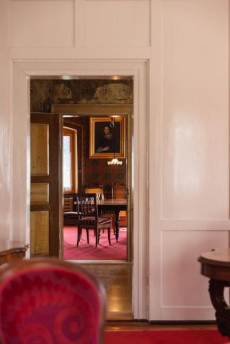 a view of a dining room with a table at Villa Carisch in Reams