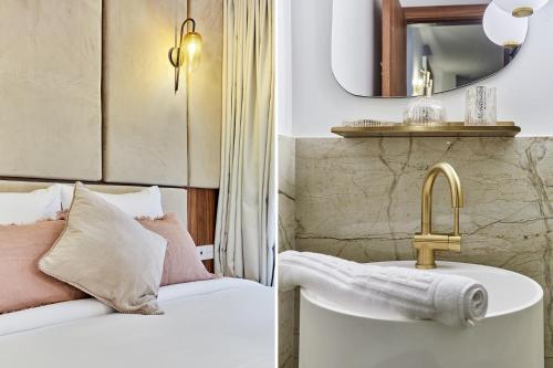 une salle de bain avec un lit, un lavabo et un miroir dans l'établissement Residence 2 Apartments Center of Paris by Studio Prestige, à Paris