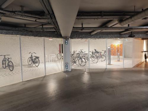 a room with drawings of bicycles on the wall at Studio en Duplex-Aircon-Terrasse-Parking-Calme in Bordeaux