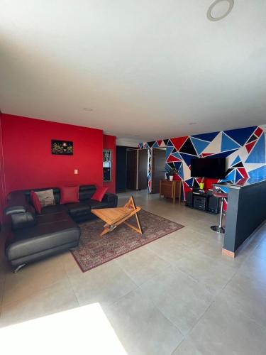 a living room with a couch and a table at Apartamento amoblado nuevo in Pereira