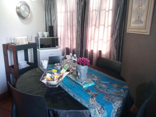 a room with a table with flowers on it at Hilton Castle in Hilton