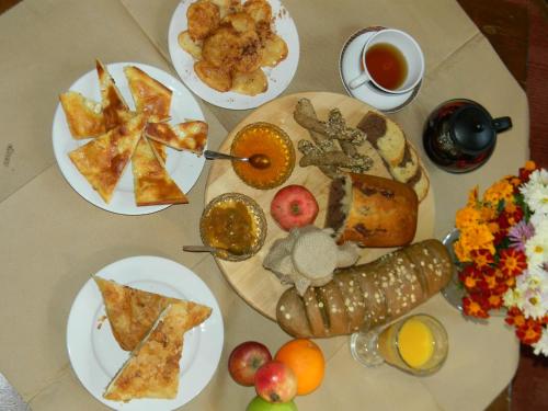 a table with plates of food on a table at Agnantio in Ioannina