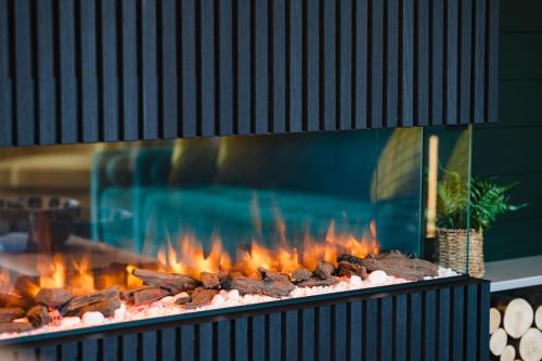 a grill with a bunch of food on it at Kite Lodge in Little Bytham