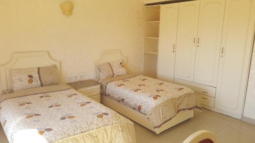 Postel nebo postele na pokoji v ubytování Al Khaleej Hotel Apartments