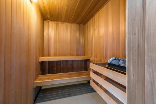 a sauna with wood paneled walls and a wooden floor at The West Vancouver luxurious house in West Vancouver