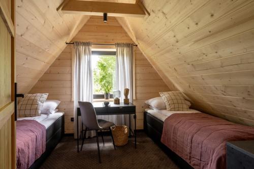 Posteľ alebo postele v izbe v ubytovaní Furmanova Chalets
