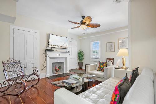a living room with a couch and a fireplace at Villa Mulvey # 5 in St. Augustine