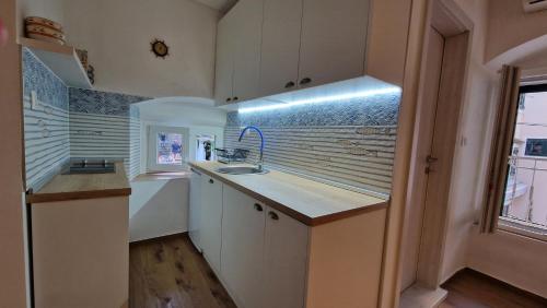 Kuchyň nebo kuchyňský kout v ubytování Apartment Vivo City Center