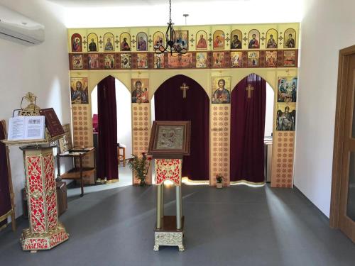 an altar in a church with a shrine at Panoramic House in Coronini