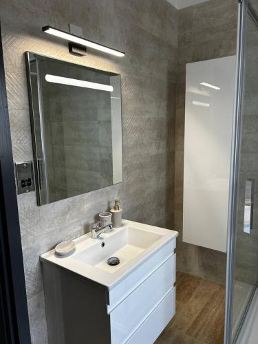 a bathroom with a sink and a mirror at Villa Mulberry - Kyrenia North Cyprus in Lapithos