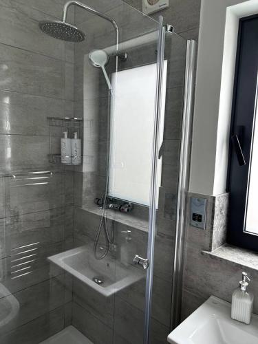a bathroom with a shower and a sink at Villa Mulberry - Kyrenia North Cyprus in Lapithos