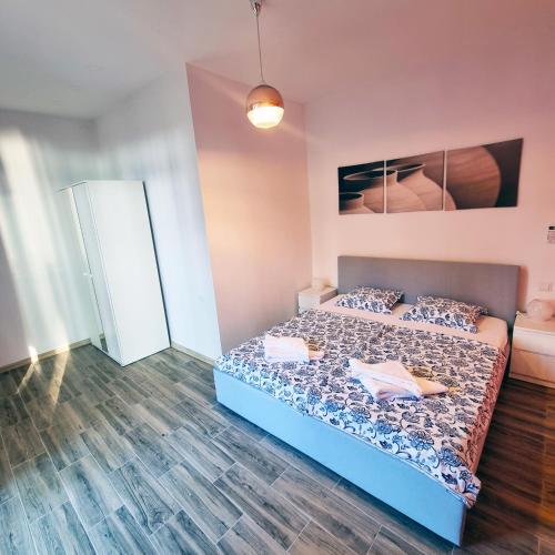 a bedroom with a bed in a room at Apartmany Paradiso Shekvetili in Shekvetili