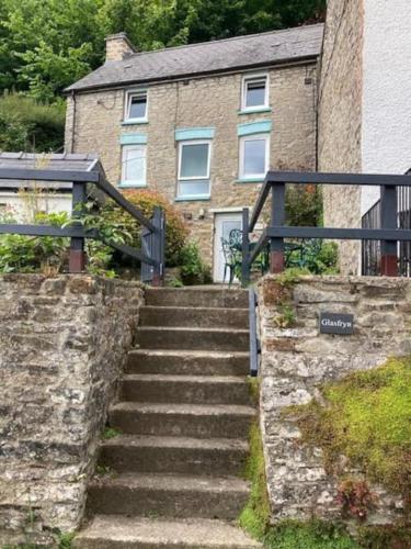 a set of stairs in front of a building at Picturesque costal cottage, quite and peaceful in Saint Dogmaels