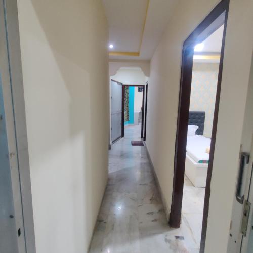 a hallway in a house with a mirror at Citynest Homestay in Guwahati