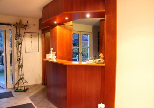 a kitchen with a counter with a mirror at Hotel Gasthaus Bock in Reichenbach an der Fils