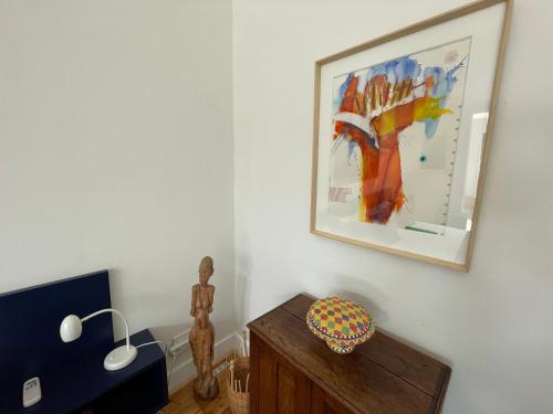 a living room with a painting on the wall at Home of Synergy in Johannesburg