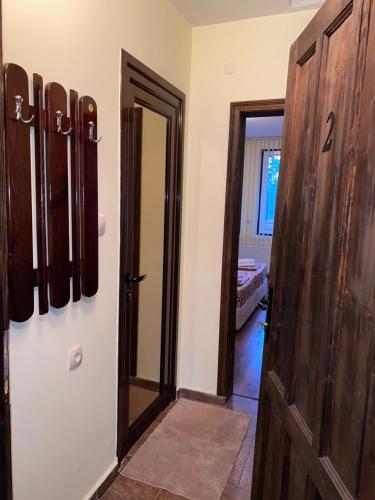 a room with a door and a room with a door at Guest House Debar in Arbanasi