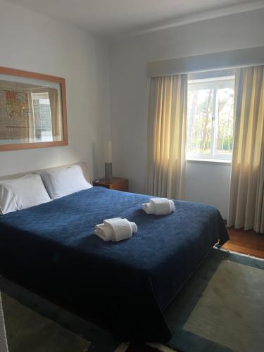 Katil atau katil-katil dalam bilik di Villa Colares