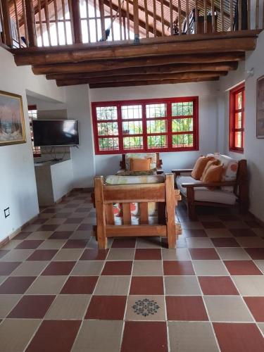 a living room with a checkered floor at Finca La Vistosa in Sasaima