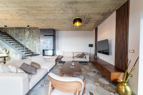 a living room with a couch and a table at Vila Marigold in Opatija