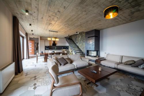 a living room with a couch and a table at Vila Marigold in Opatija