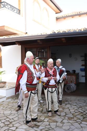 a group of men in uniforms standing outside a building at Kruja Albergo Diffuso , Inside Kruja Castle in Krujë