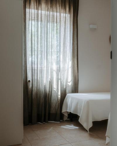 Katil atau katil-katil dalam bilik di Villa Cercis - Puglia
