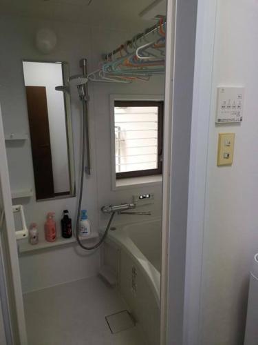 a bathroom with a shower and a sink and a mirror at 嵐天RanTen in Shimo saga