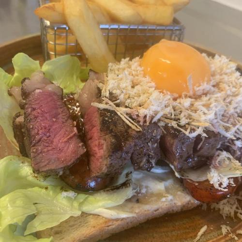 a plate with a sandwich with meat and lettuce at Böda Hotell in Böda
