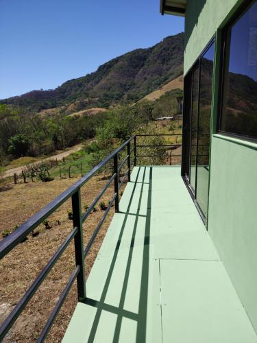 a balcony of a house with mountains in the background at Cielo Azul in Monteverde Costa Rica