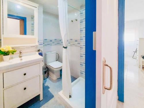 a bathroom with a toilet and a sink and a shower at LMHA25, Puerto Latino 11, Tomas Maestre Marina, La Manga in La Manga del Mar Menor