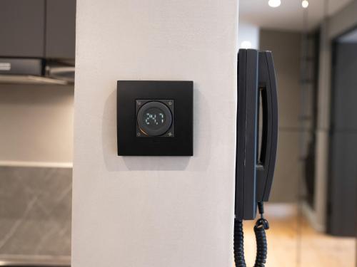 a phone is attached to a wall in an office at Space Row Design Living in Heraklio Town