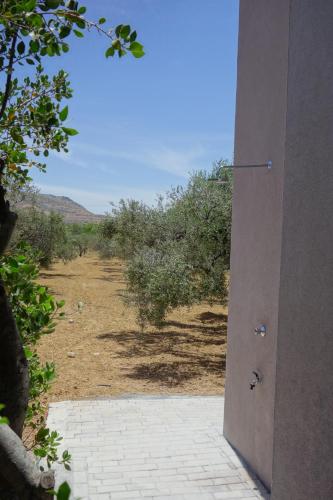 an open door with a view of a field at Metóhi Vacation House in Gournes