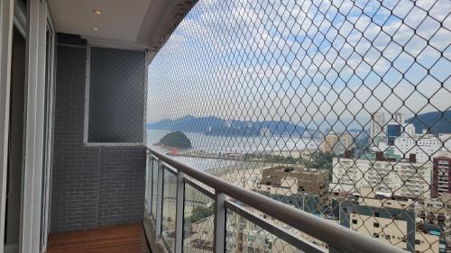 a balcony with a view of the ocean from a building at Book Santos - Unlimited 2111 Vista Mar in Santos