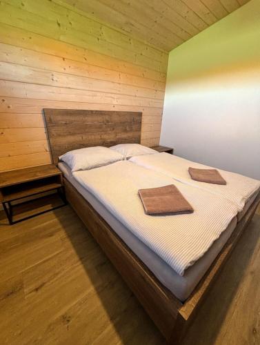 a bedroom with a bed with two mats on it at Rezort Zvernica Vlachy - Family & Fun in Vlachy