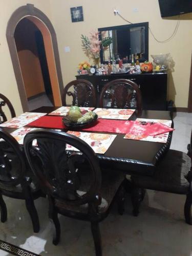 a dining room table and chairs with a table and a mirror at B&B Hideaway in Santa Cruz