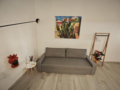a living room with a couch and a table at Teresita in Monreale