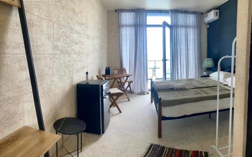 Postel nebo postele na pokoji v ubytování Seaside Grigoleti
