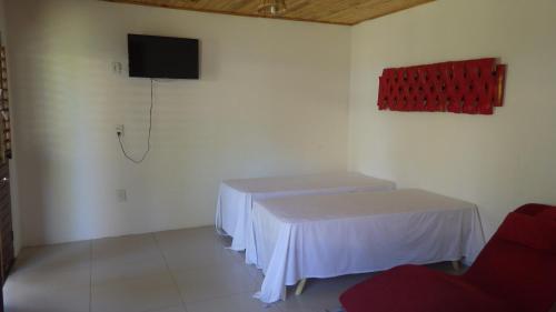 Televisyen dan/atau pusat hiburan di Pousada e Restaurante Encanto das Águas