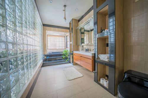 a bathroom with a sink and a mirror at Private Gramercy TownHouse 3BR 3BA with Terrace in New York