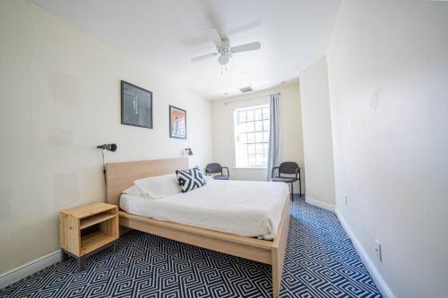 a bedroom with a bed and a table and a window at Private Gramercy TownHouse 3BR 3BA with Terrace in New York
